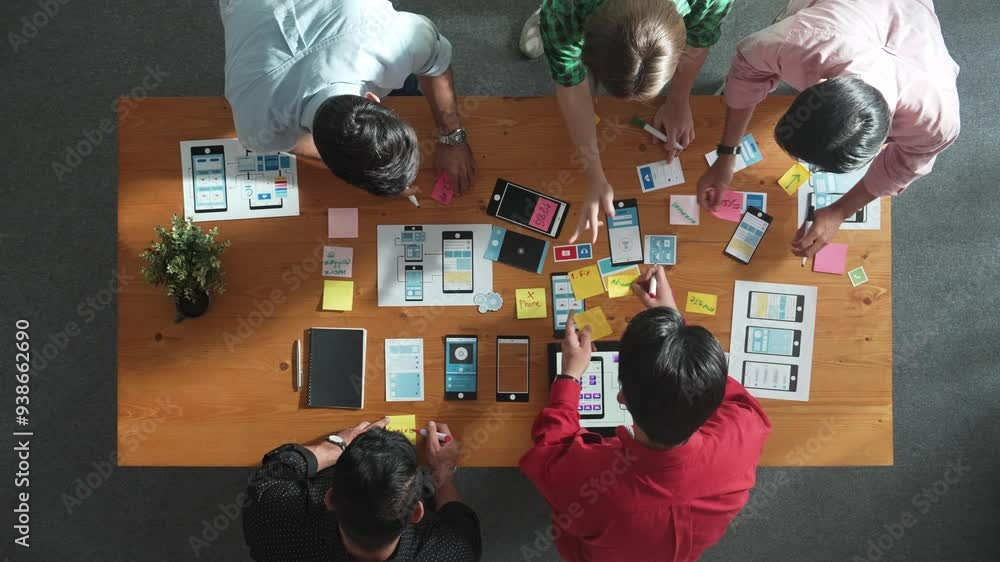 Fototapete top down view of business team writing idea on sticky note while planing for ux ui design for mobile