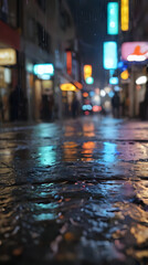 a wet street with people walking down it at night