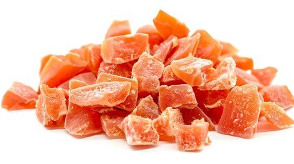 A pile of dried papaya chunks with a vibrant orange hue set against a white background. 