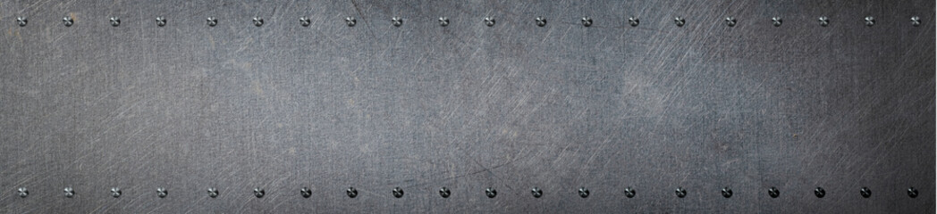 リベットのある古い金属板の背景テクスチャー