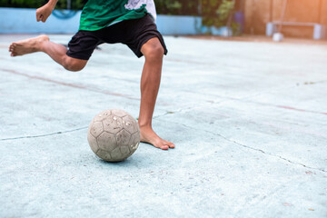 Futsal players barefoot to tackle. Futsal player control and shoot ball to goal. Soccer sports outdoor. Football futsal player.