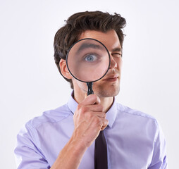 Portrait, eye and business man with magnifying glass, investigator and audit at company on white...