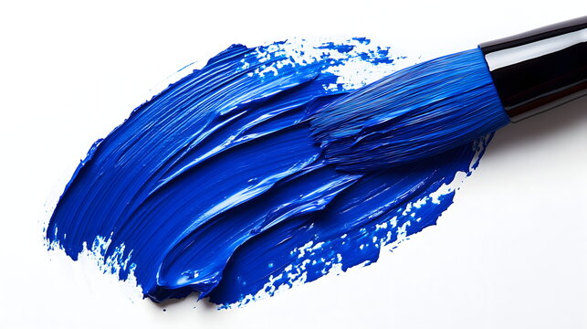 Artistic paint brush leaving thick vibrant blue acrylic stroke on white background surface. Creative painting process studio art material.
