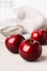 Fresh red plum on white background