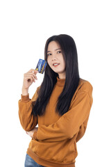 Fototapeta premium Young Asian woman showing, presenting credit card for online payment isolated on white background with clipping path.