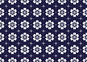 White symbol floral on dark blue background, ethnic fabric seamless pattern design for cloth, carpet, batik, wallpaper, wrapping etc.