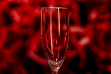 Champagne glasses on red rose bokeh background