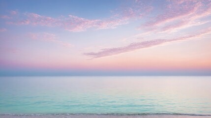 Obraz premium Serene ocean waves gently lapping against a tranquil beach under a pastel-hued sunset sky. Calming seascape with soft, pink and blue colors, perfect for relaxation and peaceful nature themes.