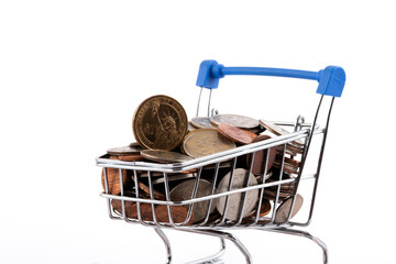 Supermarket shopping cart filled with US coins on white background