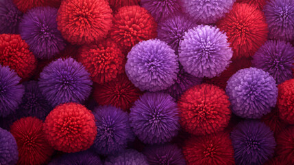 A vibrant and lively background filled with an assortment of pink and red pompon flowers. The fluffy, rounded blooms densely cover the entire frame, creating a lush and textured floral backdrop. 