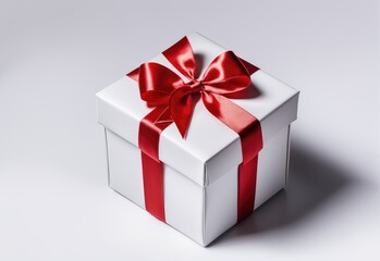 Obraz premium Gift box tied with red ribbon isolated on white background. image seen in the center and top