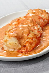Shrimp Newburg with white rice on a plate