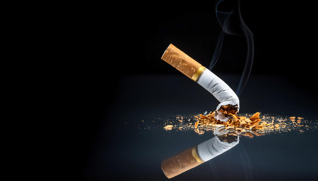 A broken cigarette on a reflective surface, symbolizing the decision to quit smoking, with a dramatic black background.