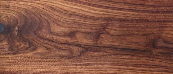 Texture of black walnut board with oil finish