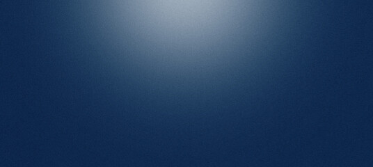 Blue studio background with fine grain texture and spotlight illuminating a centered area