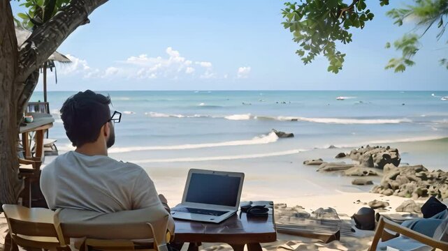 A digital nomad sits at a table with a laptop, enjoying the beautiful beach and ocean view, A digital nomad working from a beachside location with a laptop