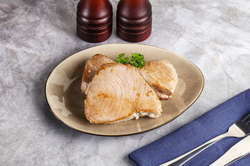 Roasted red tuna steak in the plate