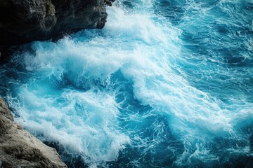 Obraz premium Close-up of turquoise ocean waves crashing. Perfect for designs about the sea, nature, and travel.