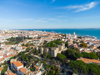 Lisbon, Portugal: Aerial drone view of the Lisbon medieval castle in the old town in Portugal capital city with the Tages river in the background