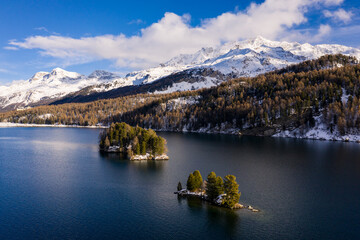 Lake Sils, Switzerland: Dramatic aerial view of lake Sils and the Corvatsch peak near St Moritz in the Swiss alps in winter