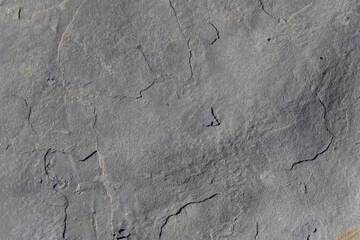 Naklejka premium Rocks worn by wind and sea found on a wild beach, which is part of a geopark.