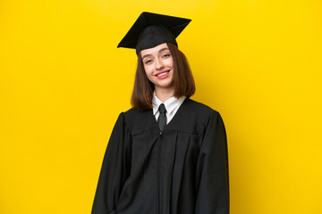 Young university graduate Ukrainian woman isolated on yellow background laughing