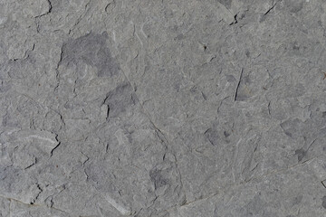 Rocks worn by wind and sea found on a wild beach, which is part of a geopark.