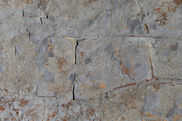 Rocks worn by wind and sea found on a wild beach, which is part of a geopark.
