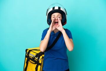 Young caucasian woman with thermal backpack isolated on white background shouting and announcing something