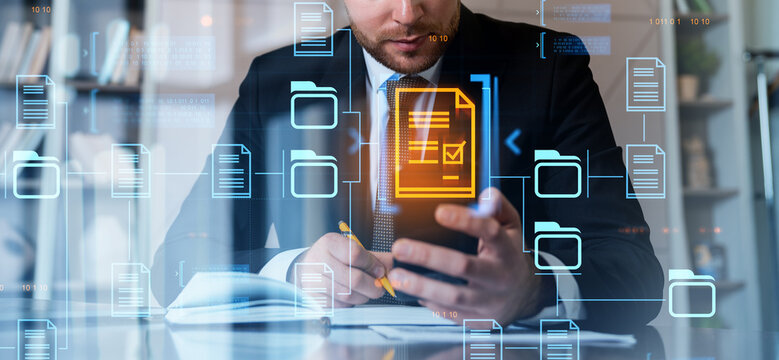 Businessman working with digital files and documents in modern o - Powered by Adobe