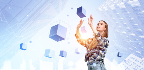 Woman interacting with virtual cubes in mixed reality cityscape.