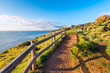 Fototapeta premium Hallett Cove to Marion Walking Trail along the coast with sea views at sunset, South Australia