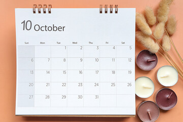 October 2024 calendar schedule ,  October 2024 calendar and candle , dry flowers on pastel beige...