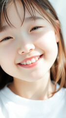 Fototapeta premium Close-up of a smiling young girl's face