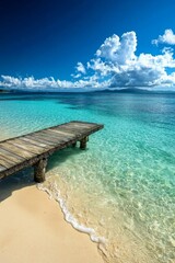 Naklejka premium A beautiful beach with a pier, crystal clear water, blue sky 