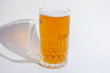 A frosty glass mug filled with golden beer, ideal for celebrating Oktoberfest and other festive gatherings