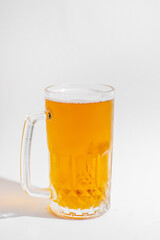 A frosty glass of refreshing golden beer, perfect for celebrating Oktoberfest or enjoying a summer weekend barbecue