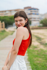 Young pretty woman at outdoors . Portrait