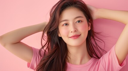 Fototapeta premium Young Woman with Radiant Skin Smiling and Relaxing on Pink Background, Embracing Beauty and Joy