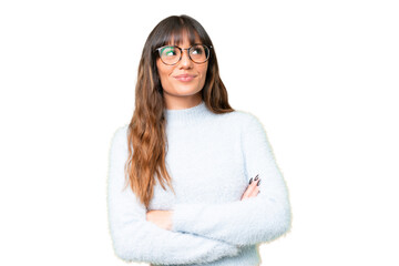 Young caucasian woman over isolated chroma key background looking up while smiling