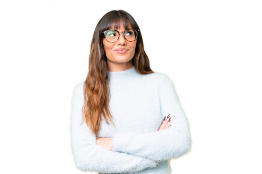 Young caucasian woman over isolated chroma key background looking up while smiling