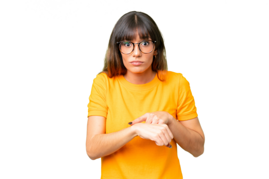 Young caucasian woman over isolated chroma key background making the gesture of being late