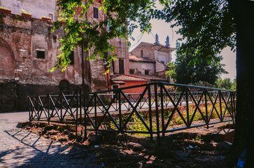 A charming courtyard nestled amidst the bustling streets of Rome.