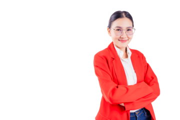 Smiling professional young businesswoman in red suit with arms crossed, standing confidently against a white background. The image reflects leadership, confidence, and success in a corporate setting.