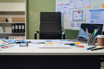 Naklejka premium Workspace area with laptop tablet smartphone and paperwork on the table in the office concept.
