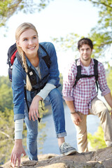 Hiking, couple and thinking with woman by rocks for outdoor adventure, journey and travel together. Smile, man and happy with backpack by mountain for exploration, trekking and tourism in Argentina