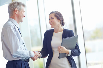 Handshake, hiring and laptop with business people in office together for interview or recruitment....