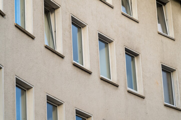 rows of windows on an older residential building