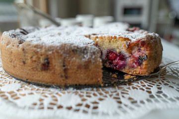 Closeup of a delicious plum cake on a table. Front view