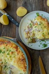 Homemade potato casserole with ham, cheese, eggs and cream.